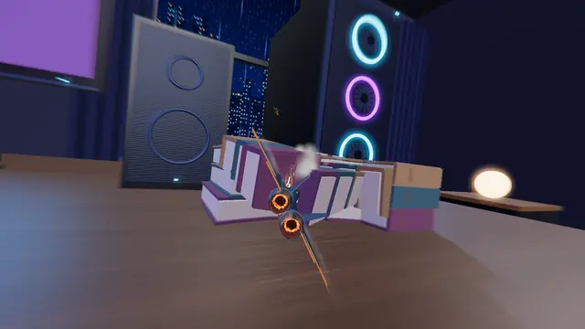 TOYBORNE screenshot: the fighter skims a stack of books beside a speaker and a neon PC